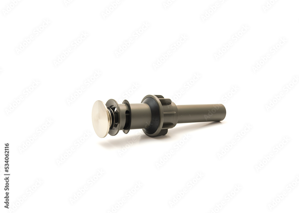 Stainless steel push down drain stopper with overflow hole allows water to drain from the sink hole into the drain isolated on white background Stainless steel push down drain stopper with overflow hole allows water to drain from the sink hole into the drain isolated on white background