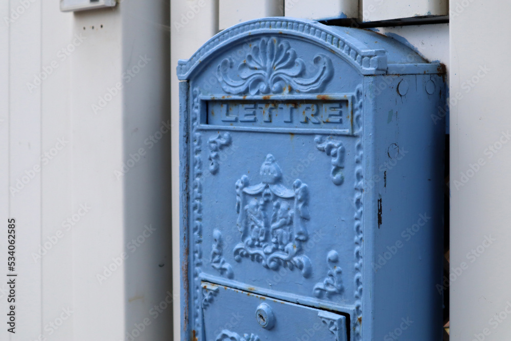 Old blue mailbox with the French inscription Old blue mailbox with the French inscription