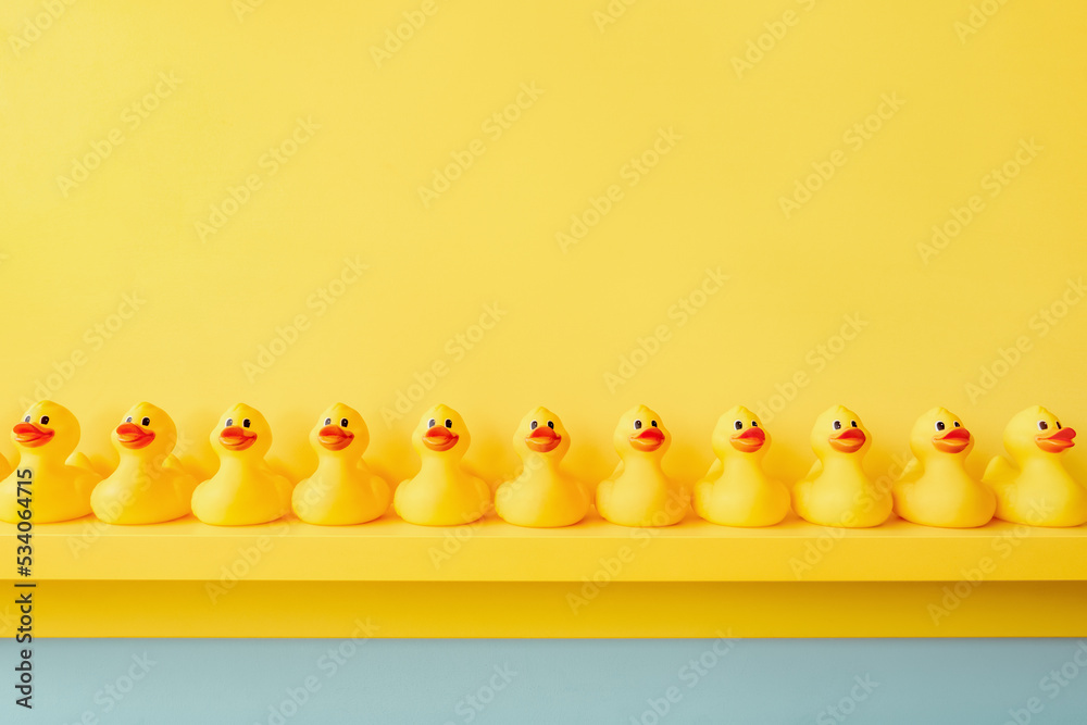 Yellow rubber duck in a line toy design yellow concept team work