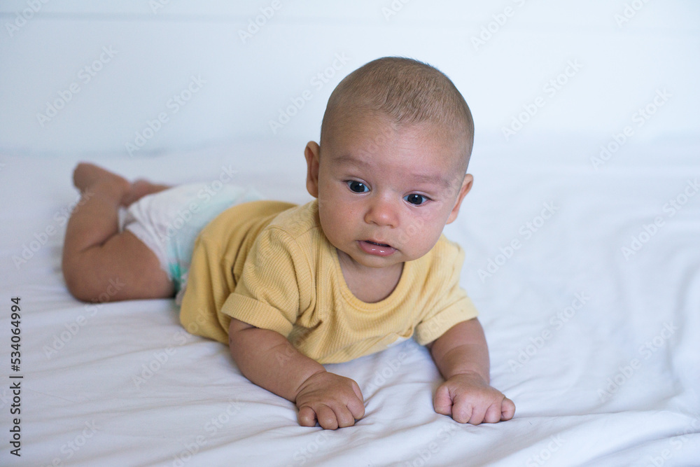 Baby in yellow shirt