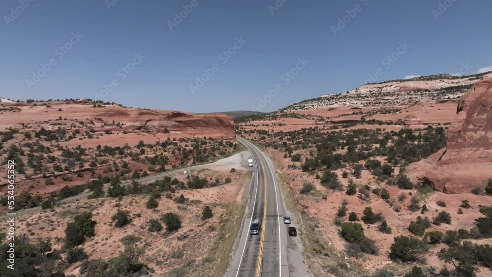 Classic panorama view of historic U.S. Route 163 running through famous Arches National Park in beautiful golden evening light