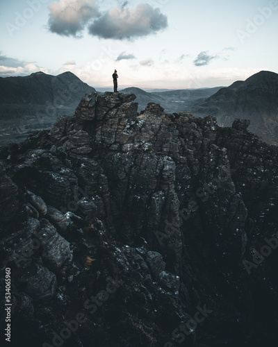 person on the top of a mountain © Alex