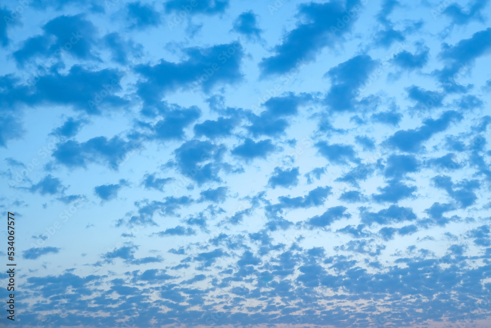 Blue sky with white clouds. Beautiful cloudy sky. Skyward. Endless skyline. The sky at dawn.
