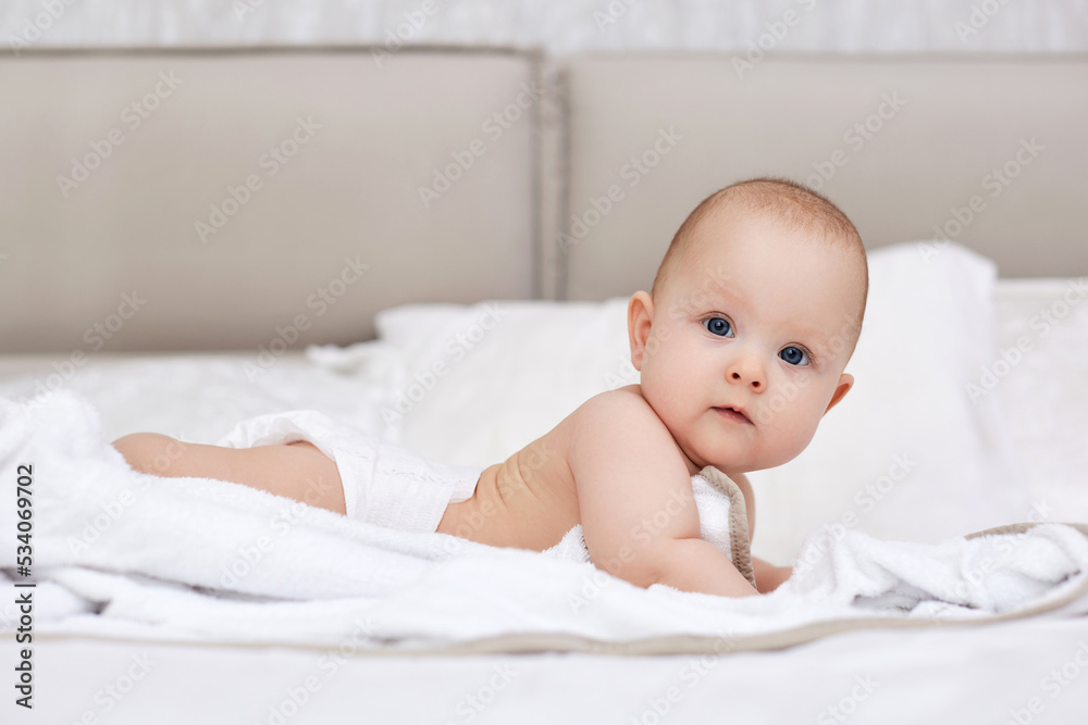 newborn baby girl in the white bed