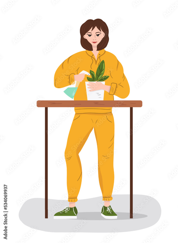 Fototapeta premium Woman in a tracksuit watering flowers.