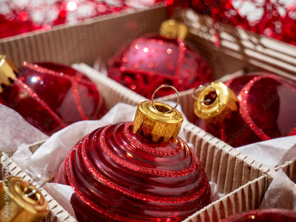 Christmas box with red Christmas balls and gifts, Christmas trinkets Christmas box with red Christmas balls and gifts, Christmas trinkets
