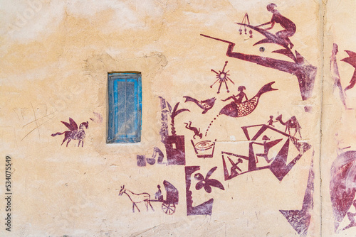 Blue window and mural on a bulding in Faiyum.