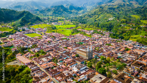 Medellin Mountains Aerial Drone Top Notch Above Jardin in Colonial Humid Valley Neighbourhood, Houses and Clear Skyline photo