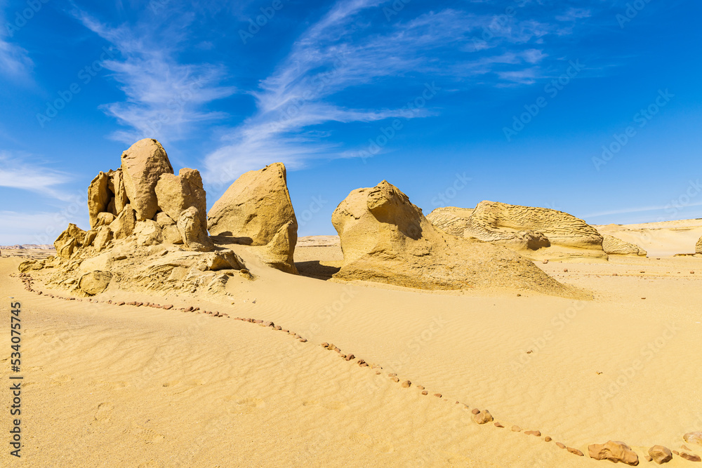 Eroded rocks along the interpretive trail at Wadi el-Hitan paleontological site.