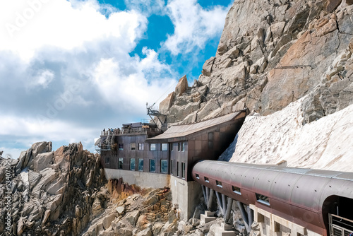 Chamonix, france - august 2022: Tourist facilities at the top of the french aiguille du midi, in view of montblanc.