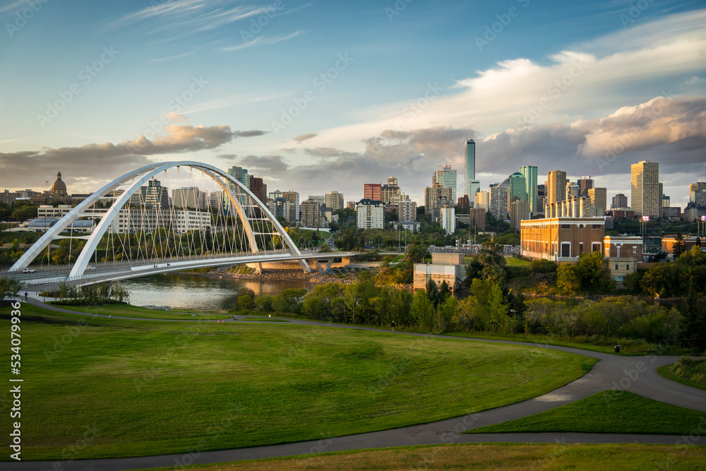 Edmonton, Alberta, Canada skyline at dusk with suspension bridge 