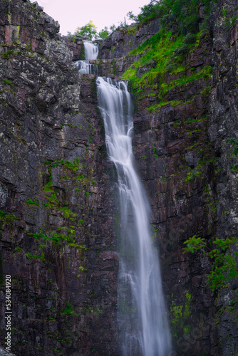Sweden s highest waterfall  Njupesk  r  is 93 metres high with a free fall of 70 meters. The waterfall is located in Fulufjallet National Park  Sweden. High resolution photo.