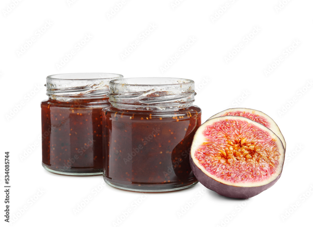 Glass jars of tasty sweet fig jam isolated on white Glass jars of tasty sweet fig jam isolated on white