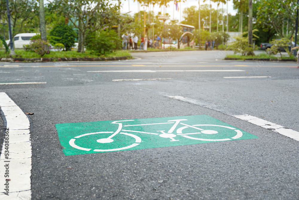 Obraz premium A bicycle lane is a path for cycling exercises in the park. Soft and selective focus.