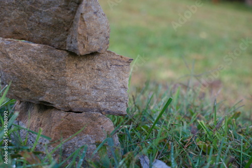 Wallpaper Mural stacked rock column monument in an open grass field within a farm on a clear calm peaceful day on a hill in the country Torontodigital.ca