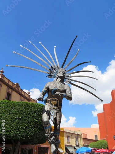 statue of Danzante Conchero Chichimeca in Queretaro, Mexico photo