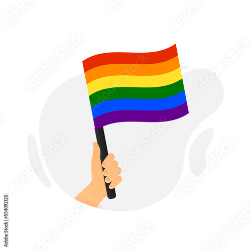 A hand holds a flag in support of the lgbt community. Vector illustration.