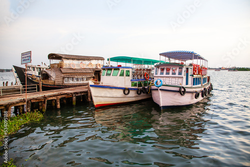 Anchored tourist boats at Ernakulam Jetty of Kerala, India.