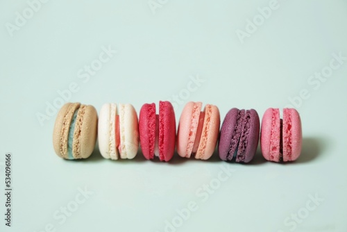 Colorful of sweet French macaroons on pastel color background,copy space.