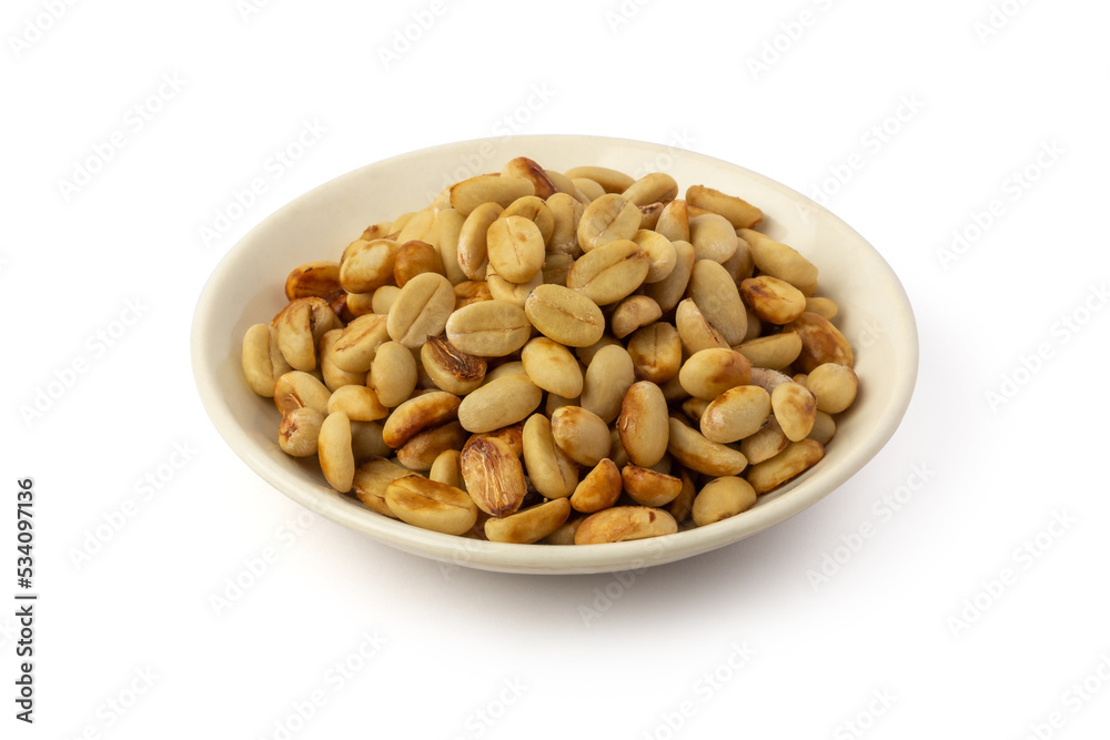 dried coffee beans with hull or parchment skin on white plate, coffea arabica, pulp and skin or flesh of the coffee cherry is removed from the beans, processing step on white background dried coffee beans with hull or parchment skin on white plate, coffea arabica, pulp and skin or flesh of the coffee cherry is removed from the beans, processing step on white background