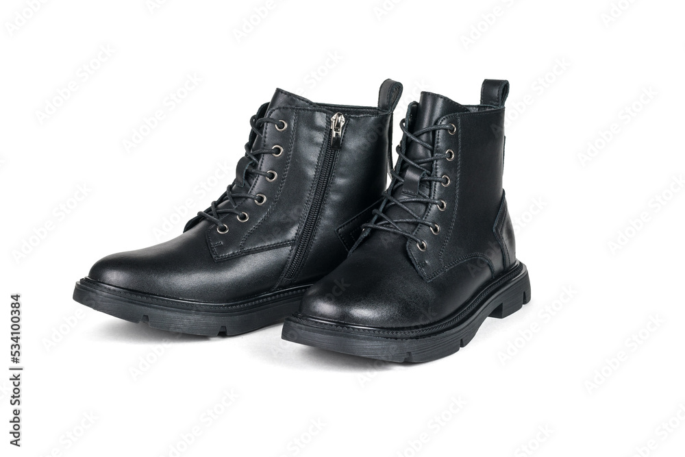 High leather boots with heels and laces isolated on a white background. High leather boots with heels and laces isolated on a white background.