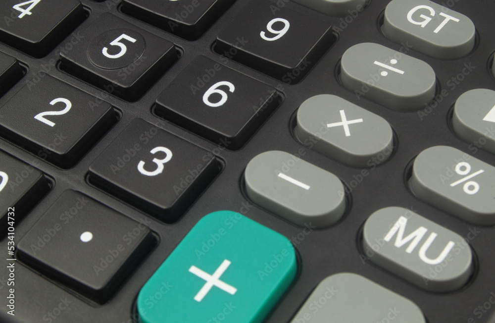 Black calculator as background.