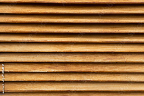 Brown wood background The wooden slats are arranged in rows and decorated as wooden slats to enhance the beauty of the place. abstract background.