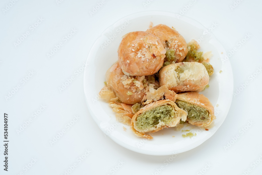 Indonesian local oven baked bread stuffed with green beans, with a crispy layered skin texture Indonesian local oven baked bread stuffed with green beans, with a crispy layered skin texture
