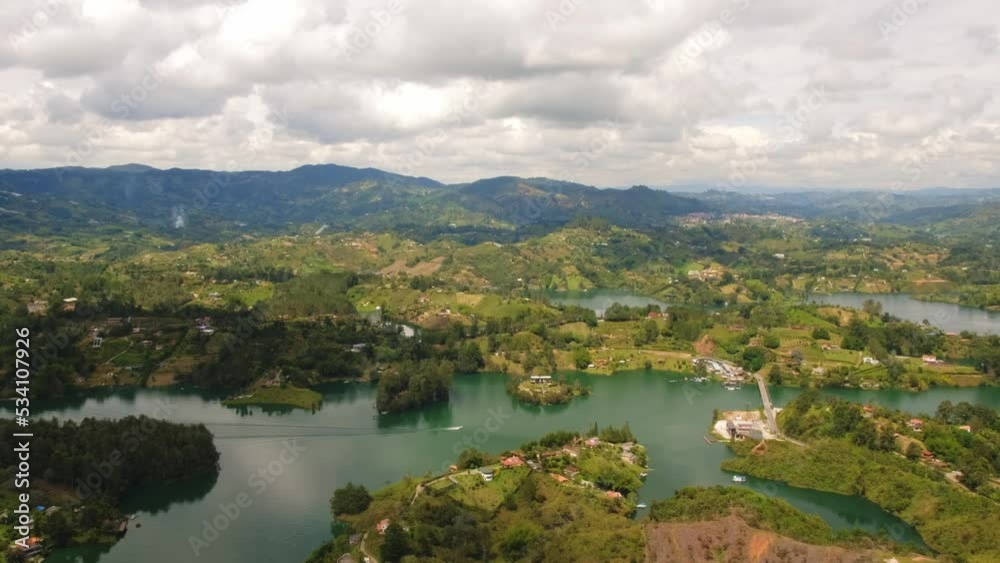 Panoramic Guatape Medellin Colombia Antioquia Aerial Drone Above Lake Cloudy Day Crystalline Water and Green Hills Zoom Out Piedra del Peñol Panoramic Guatape Medellin Colombia Antioquia Aerial Drone Above Lake Cloudy Day Crystalline Water and Green Hills Zoom Out Piedra del Peñol