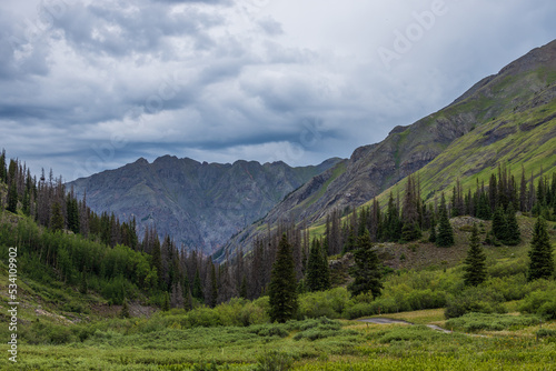 Green mountain valley with overcast skies