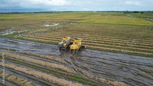 Tractors Ploughing The Paddy Rice Fields in Kedah, Malaysia