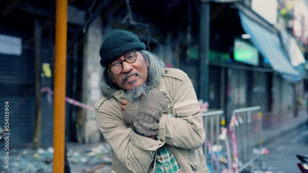 4K, Asian homeless man get cold no job begging for money healthy care, unemployed aged man retirement social problem from financial crisis  no family, abandoned vagrant tramp man on the street
