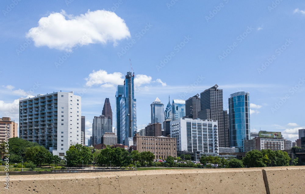 View of Downtown Philadelphia, Peninsulvlenia on a mostly sunny summer day from the freeway.