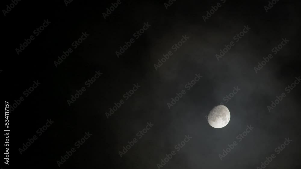 Moon in the dark sky and black clouds at night.
Moon in the dark sky and black clouds at night.