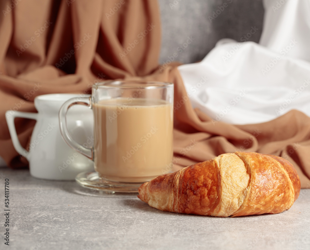 Croissant and coffee with cream. Croissant and coffee with cream.