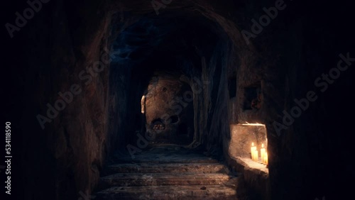 old dark catacombs with candles photo