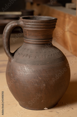 Ceramics, a ceramic product made with their own hands, made on a potter's wheel, jug, mug, clay, ornament. © nikolay_alekhin