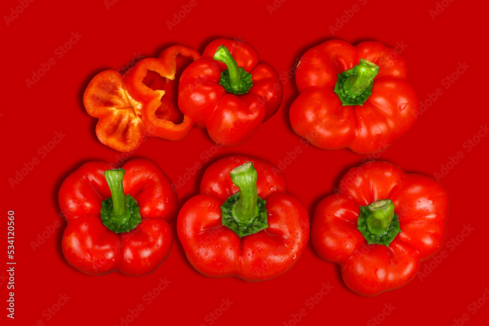 red and yellow peppers, red background