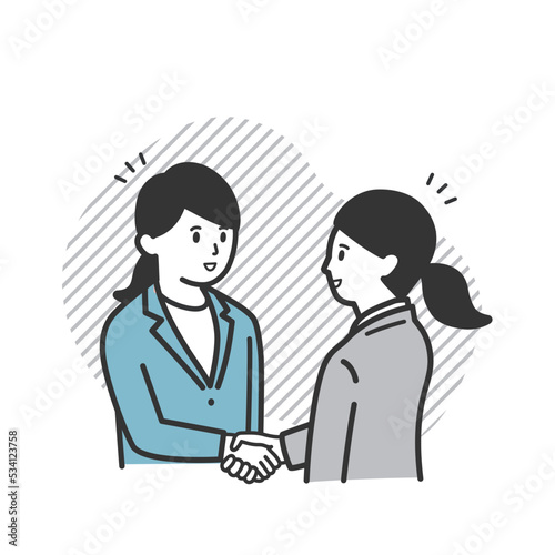 握手をする働く女性 