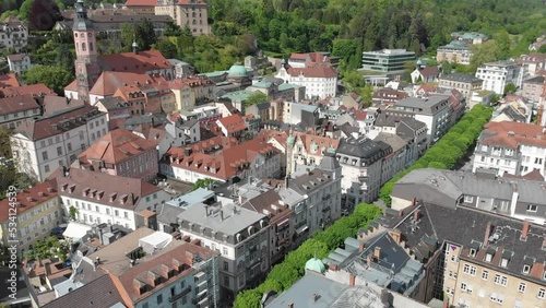 Panning drone shot of the town of Baden Baden full of colourful multi story mansions photo