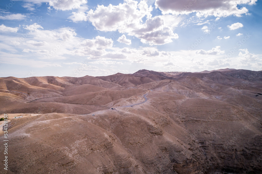 Desert in Israel. Mountains and Road in Background. Sandy Surface. Drone Point of View.
