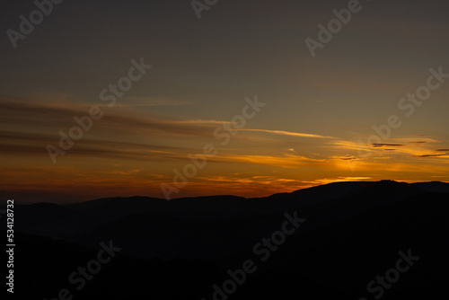 Sunset in mountains in summer landscape