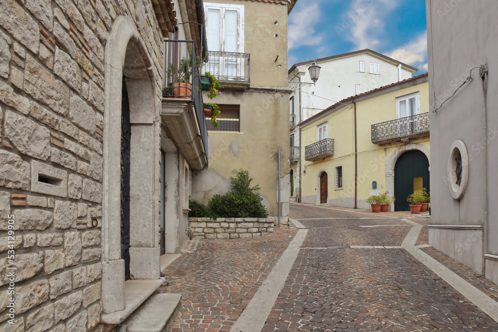 A small street between the houses of Frigento, a rural village in the province of Avellino in Italy.	
