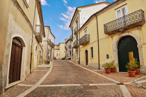 Fototapeta Naklejka Na Ścianę i Meble -  A small street between the houses of Frigento, a rural village in the province of Avellino in Italy.	