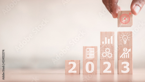 Fototapeta Naklejka Na Ścianę i Meble -  hand stack woods block step on table with icon Action plan, Goal and target, success and business target concept, project management, company strategy development.