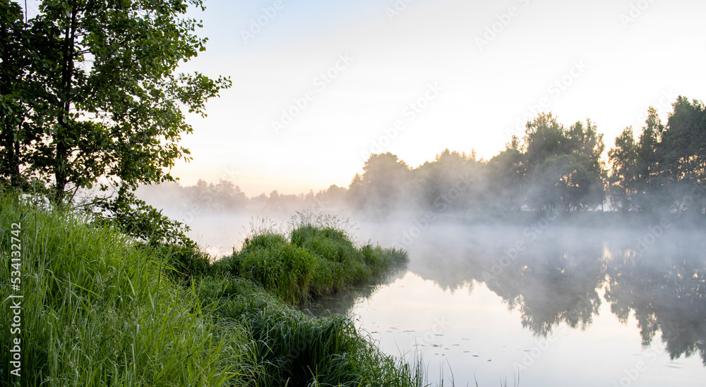 Obraz premium Fog in the early morning. Dawn by the river.