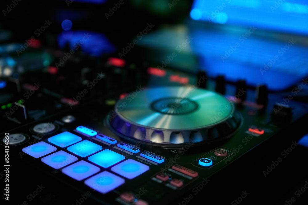 Sound mixer and turntables in night club