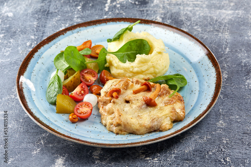 pork with mashed potato and vegetables