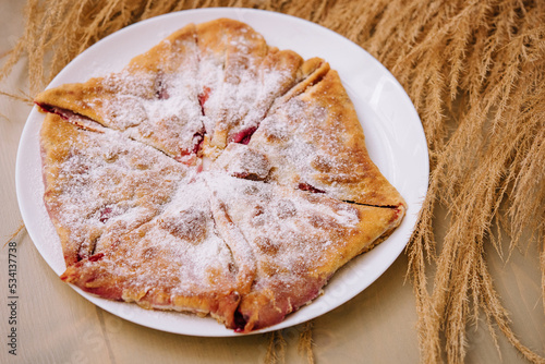 Gozleme or Moldovan pies - Placinta on plate photo