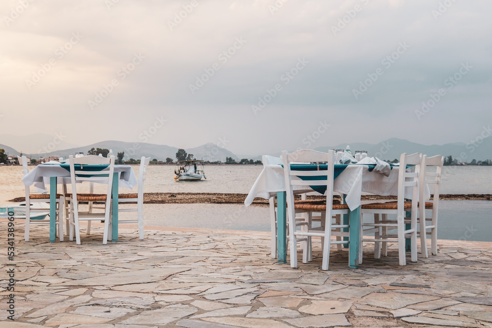 Seaside restaurant tables and chairs in Greece